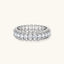 Sterling silver eternity ring with continuous row of brilliant moissanite stones in scalloped crown setting with milgrain detail