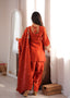 Back view of the Zarina rust farshi shalwar suit set showing the tie back detail, dupatta and matching shalwar.