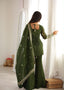 Back view of the Mehendi green bell bottom suit set showing the dori tie detail, dupatta and wide leg trousers.