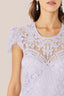 Close-up of Amara navy embroidered lace bodice and scalloped V neckline