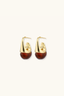 Pair of Amber Flow Drops showing polished gold curve and glossy amber resin drop detail