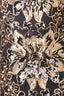 Close-up of black and gold floral sequin mesh fabric