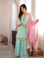 Full length front view of the Mira mint sharara suit set with pink dupatta and wide leg sharara trousers.