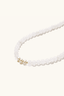 Close-up of jade and freshwater pearl bracelet with gold vermeil accents and orange agate lotus bead