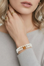 Model one wearing Lotus Jade Wrap Bracelet triple wrap jade and pearl beaded bracelet