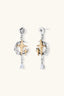 Vesper Star Drops two-tone star drop earrings with brushed gold stars, silver sculptural frames and clear pear-cut zirconia drops