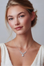 Model wearing sterling silver moissanite wing necklace with halo drop pendant
