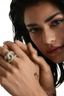 Model two wearing the Luce Link Ring on the finger, styled as a bold standalone piece with a clean, neutral look