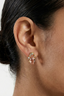 Model wearing Coral Heirloom Studs gold plated baroque studs with coral-pink glass and zirconia sparkle