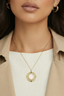 Model wearing Cosmic Pearl Pendant – gold plated mother of pearl pendant necklace for everyday jewellery styling