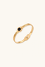 Close-up of 18K gold plated bracelet with black mother of pearl dial