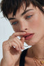 Model wearing two wearing gold-plated zirconia band, showing prong settings and cut-out arche