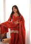 Model wearing the Zarina rust embroidered farshi shalwar suit set with matching dupatta, front upper body view.