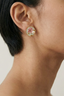 Model wearing Garden Dream Studs small floral pearl studs in gold plated finish