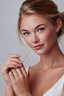 Model wearing Radiant Heart Halo Ring sterling silver heart moissanite halo ring on hand