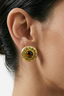 Model wearing tiger’s eye halo stud earring in gold with green accents, bold everyday statement