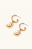 Angled view of hammered gold vermeil hoops with square drop detail and 8mm freshwater pearl