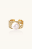 Close-up of textured 14K gold-plated band and round freshwater pearl statement ring