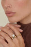 Model 2 wearing the Golden Hour Duo ring set — an adjustable 18K gold plated halo cubic zirconia ring stacked with a chunky chain band on the hand