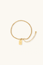 Gold bracelet with engraved good luck charm pendant on delicate chain