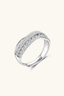 Eternal Crossover Moissanite Ring angled view showing intersecting silver bands with moissanite stones