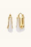 Liquid Curve Hoops gold-plated chunky hoop earrings with white resin, front and side angle