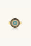 Front view of gold plated evil eye ring with Greek meander border and turquoise stones