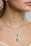 Model wearing Pearl Halo Necklace — freshwater pearl pendant with crystal halo on sterling silver chain