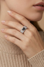 Model one close-up of geometric chevron ring featuring black centre squares and clear zirconia