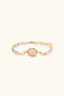 Close-up of rose quartz centre stone bracelet with freshwater pearls and pastel gemstone beads