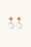 Royal Garden Pearl Drops styled with white linen by the coast, outdoor setting