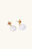 Close-up of baroque pearl drops, showing gold-plated stud and pink centre detail