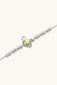 Close-up of sterling silver bracelet with 1ct yellow moissanite centre stone