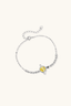 Adjustable silver chain bracelet with yellow moissanite and star accent