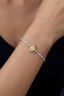 Model wearing yellow moissanite sterling silver bracelet on wrist