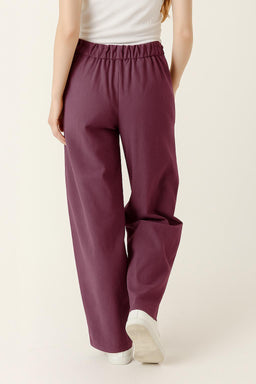 Rear view — wide-leg silhouette and adjustable drawstring waist