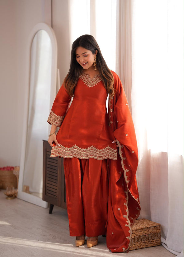 Back view of the Zarina rust farshi shalwar suit set showing the tie back detail, dupatta and matching shalwar, video